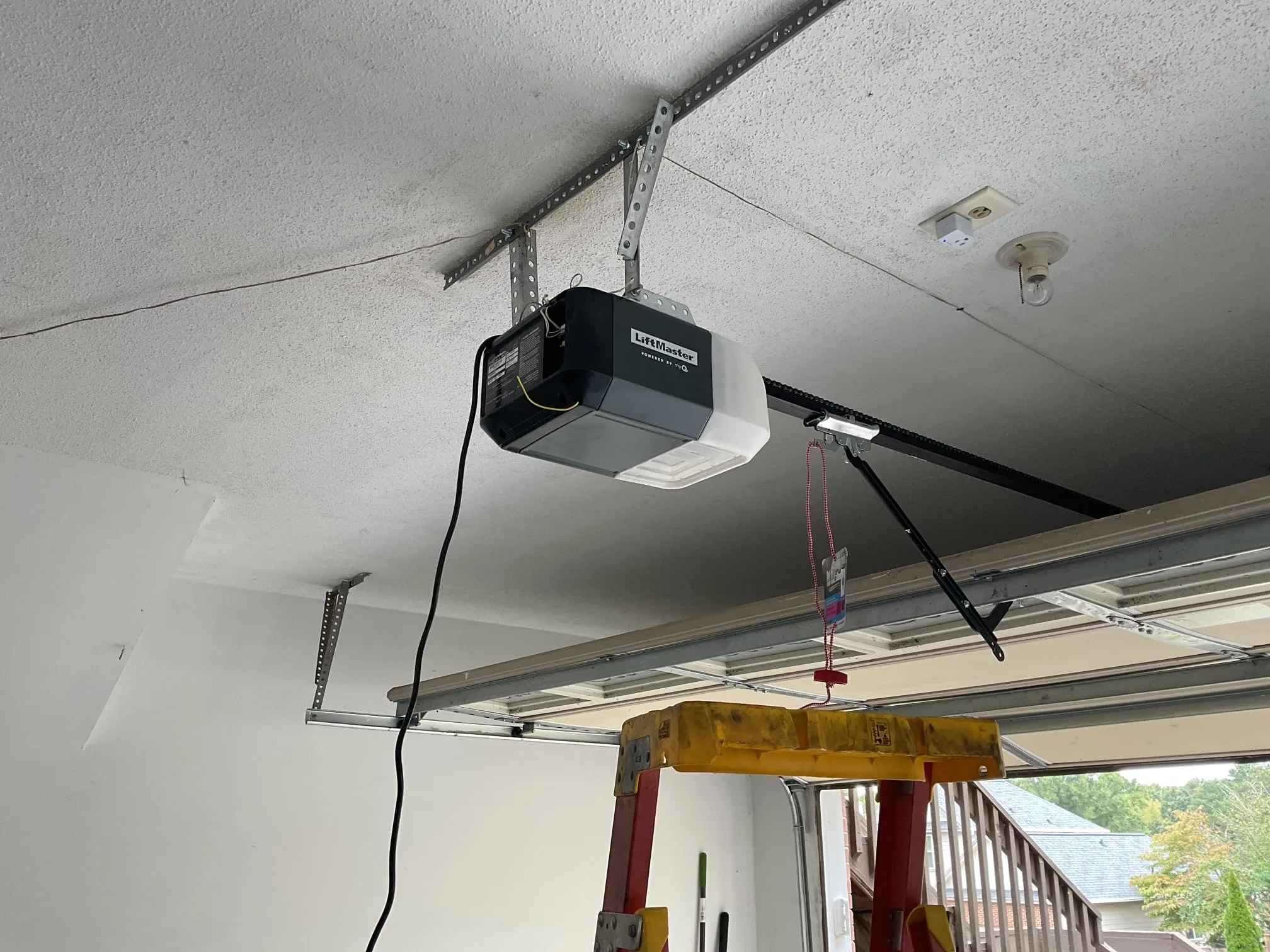 Ceiling-mounted residential garage door opener after installation